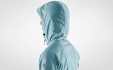 Sky blue branded women winter hoodie with fox logo on the shoulder and a pocket on chest.