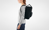 a girl wearing kanken laptop daypack